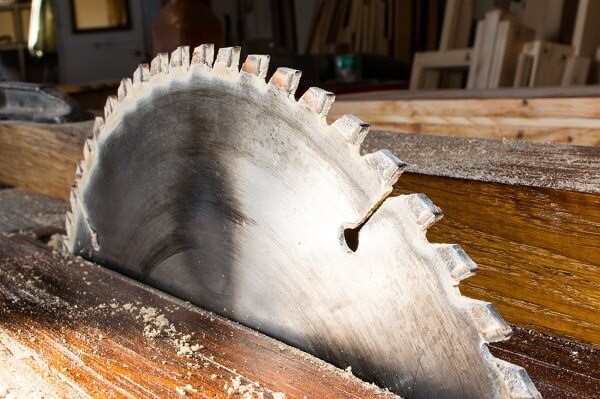 A close view of the circular saw blade in the carpenter's workshop