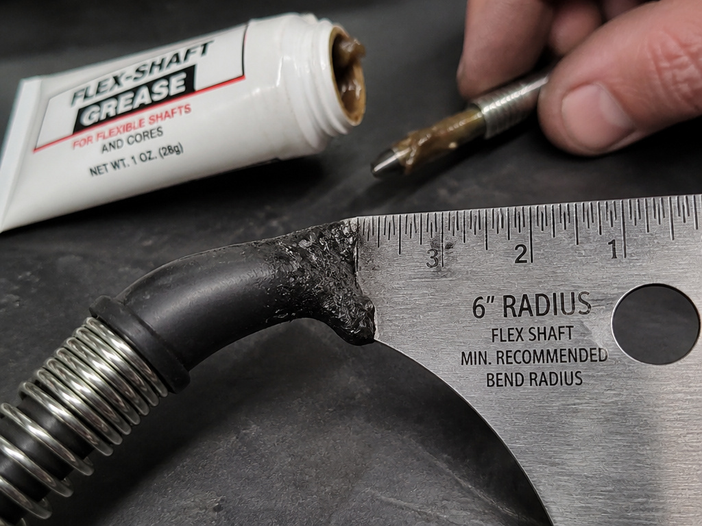 Flex shaft maintenance showing cable kink damage and mandatory lubrication.